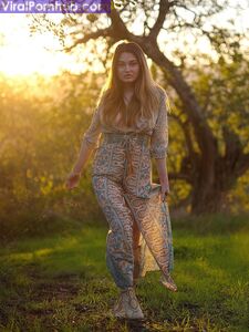 Solo model Gabriella Knight shows some tits and ass by an old outbuilding