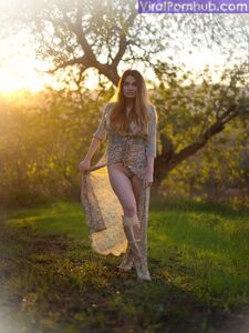 Solo model Gabriella Knight shows some tits and ass by an old outbuilding